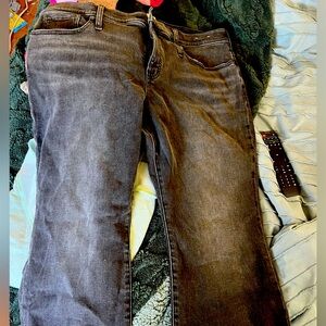 Madewell women’s black jeans with frayed hem.